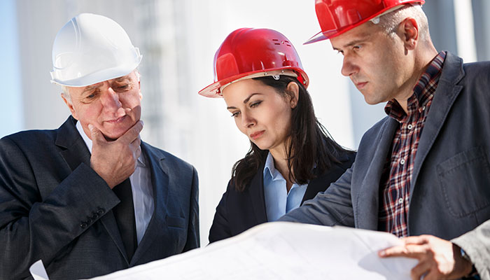 Engineers discussing at industrial facility
