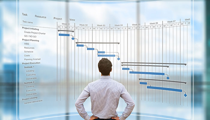 Project manager looking at AR screen chart schedule