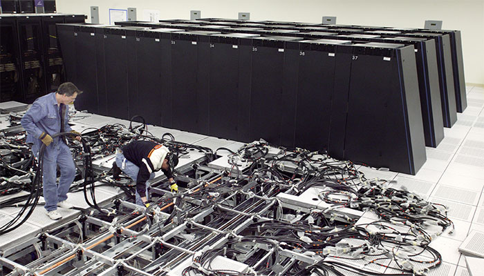 Two engineers working on cables
